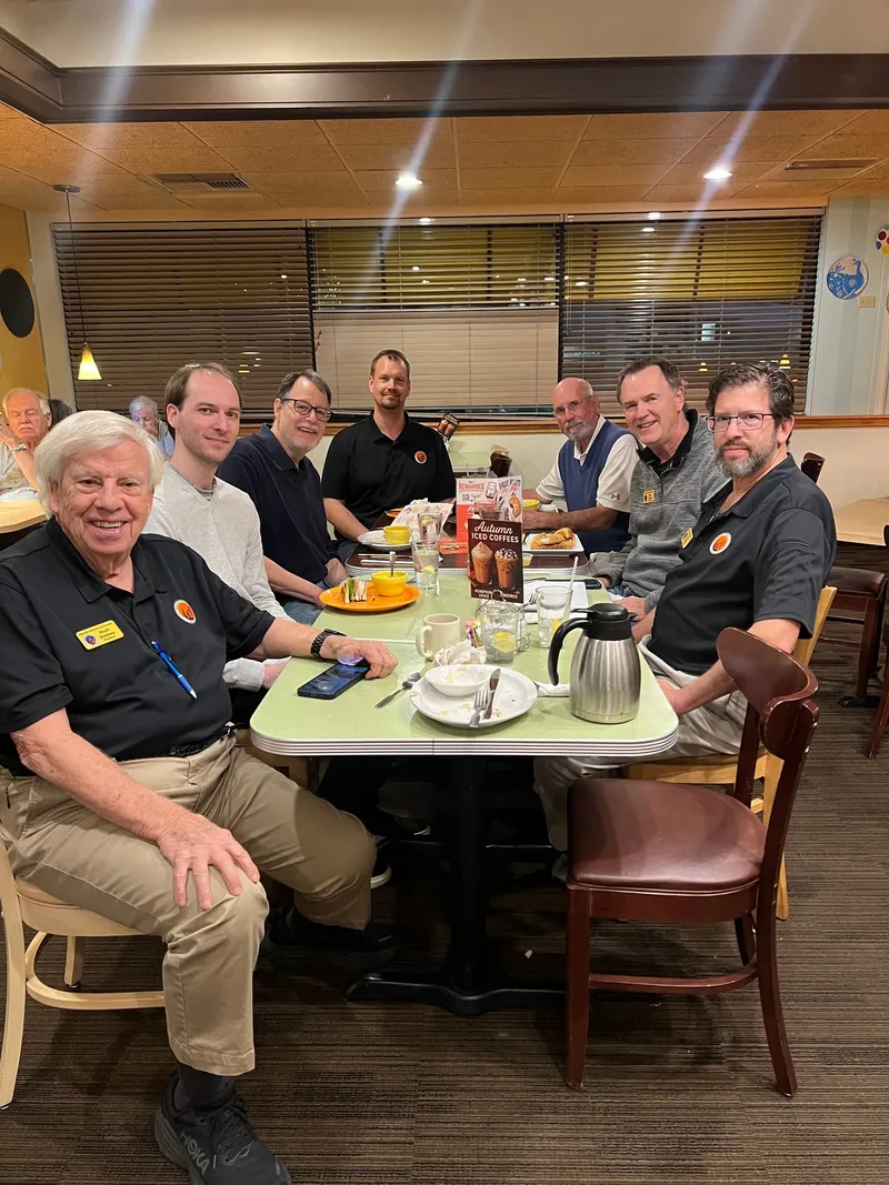 PAS officers and members gathered at a restaurant table for a Meeting of the Minds dinner